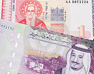 A Bulgarian one lev bill with Saudi Arabian money