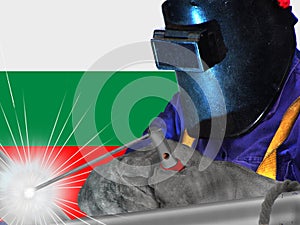 BULGARIAN WELDER WITH BACKGROUND OF HIS FLAG WAVES