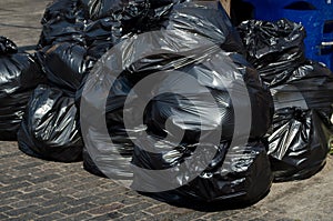 Bags of trash piled up photo