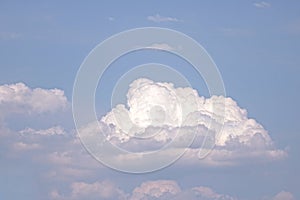 BULGING WHITE CUMULUS CLOUD IN THE SKY