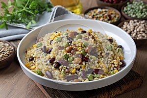 Bulgur pilaf with legumes with peas, beans and corn kernels