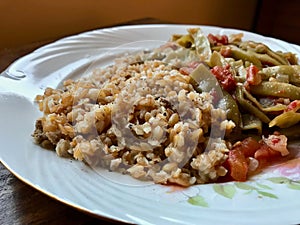 Bulgur Rice made with Siyez Unu Einkorn Flour Triticum monococcum with Green Beans Zeytinyagli Fasulye / Pilav or Pilaf.