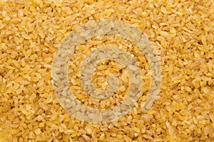 Bulgur wheat grains forming textured background