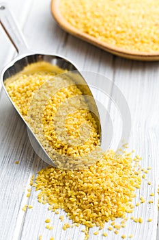 Bulgur wheat in metal scoop