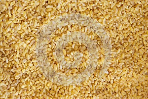 Bulgur wheat yellow background and texture pattern