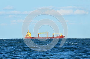 Bulk cargo ship on horizon