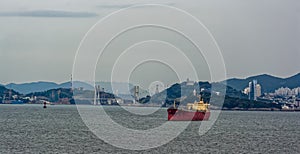 Bulk cargo vessel anchored in the harbor.