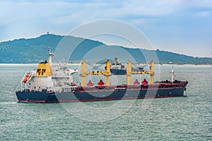 Bulk carrier cargo ship anchored in outer anchorage of Singapore