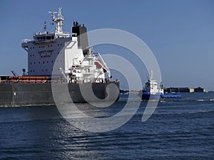 Bulk carrier maneuvering in the harbor