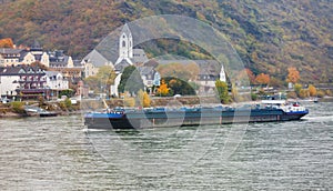 Bulk-carrier ship navigating river Rhine Germany