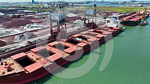 Bulk Carrier Ship Offloading Cargo By Crane for Processing