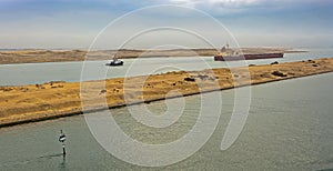 Bulk carrier ship passing through Suez Canal