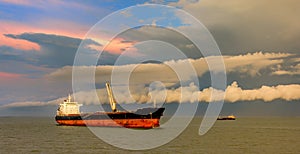 Bulk carrier vessel is awaiting loading at outer anchorage of Kamsar port, Guinea, West Africa photo