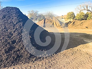 Bulk compost wholesale plant near highway with pile of organic matters near Dallas, Texas