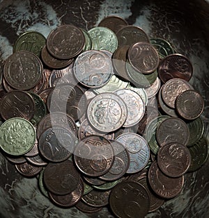 Bulk of german coins from topview on black background photo