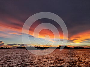 The bulk ship in anchorage, sunset