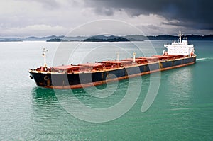 Bulk transport carrier under stormy sky