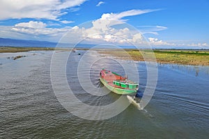 A Bulkhead boat on the river under beautiful sky photo