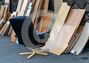 Bulky waste with office chair for recycling on the street