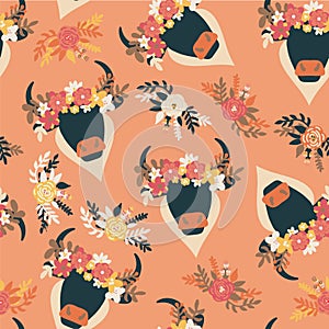 Bull Boho head seamless vector pattern. Abstract ox with horns and ethnic flower arrangement on orange repeating multidirectional