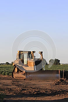 Bull Dozer in a field at a work site