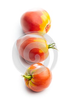 Bull heart tomatoes isolated on white background