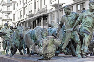 Bull running monument statue in Pamplona, Spain photo