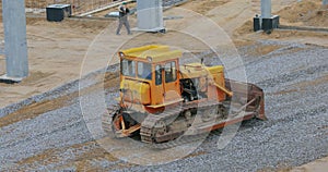 Bulldozer at the construction site. Yellow bulldozer at the construction site. Heavy construction equipment