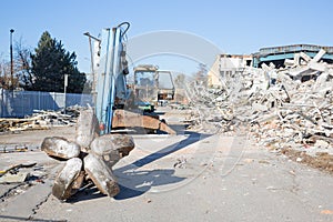Bulldozer crushing the building
