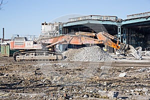 Bulldozer crushing the building