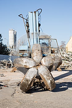 Bulldozer crushing the building