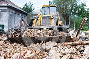 Bulldozer demolishing an old building