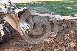 A Bulldozer Digging In Yard For Pool Installation