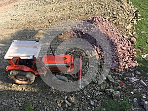 Bulldozer dirt leveling on plot of land