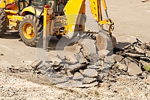 Bulldozer Dismantles Asphalt at Work