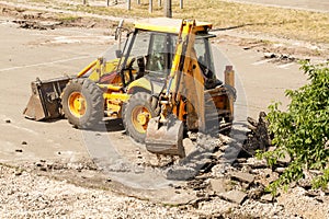 Bulldozer Dismantles Asphalt at Work