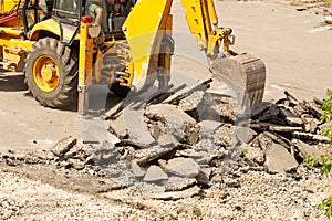 Bulldozer Dismantles Asphalt at Work