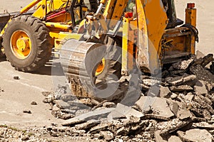 Bulldozer Dismantles Asphalt at Work