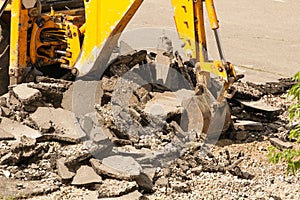 Bulldozer Dismantles Asphalt at Work