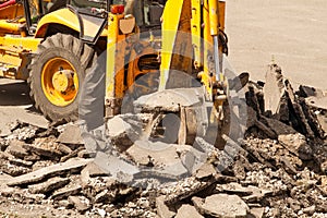 Bulldozer Dismantles Asphalt at Work