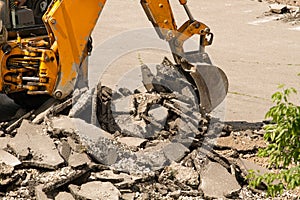 Bulldozer Dismantles Asphalt at Work