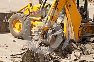 Bulldozer Dismantles Asphalt at Work