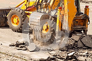 Bulldozer Dismantles Asphalt at Work