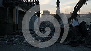 Bulldozer dismantles the old building