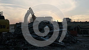 bulldozer dismantles the old building