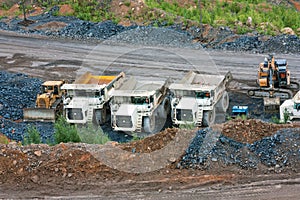 Bulldozer, dump trucks and excavator