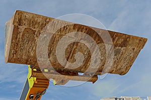 Bulldozer excavation scoop on sky background