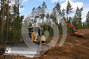 Bulldozer and excavator