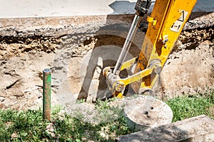 Bulldozer excavator machinery excavate and prepare to loading ground to tipper truck on the street reconstruction site of district