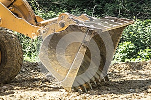 Bulldozer flattens road